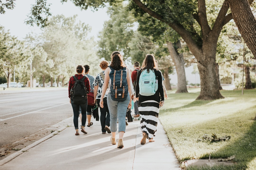 Students walking across a college campus